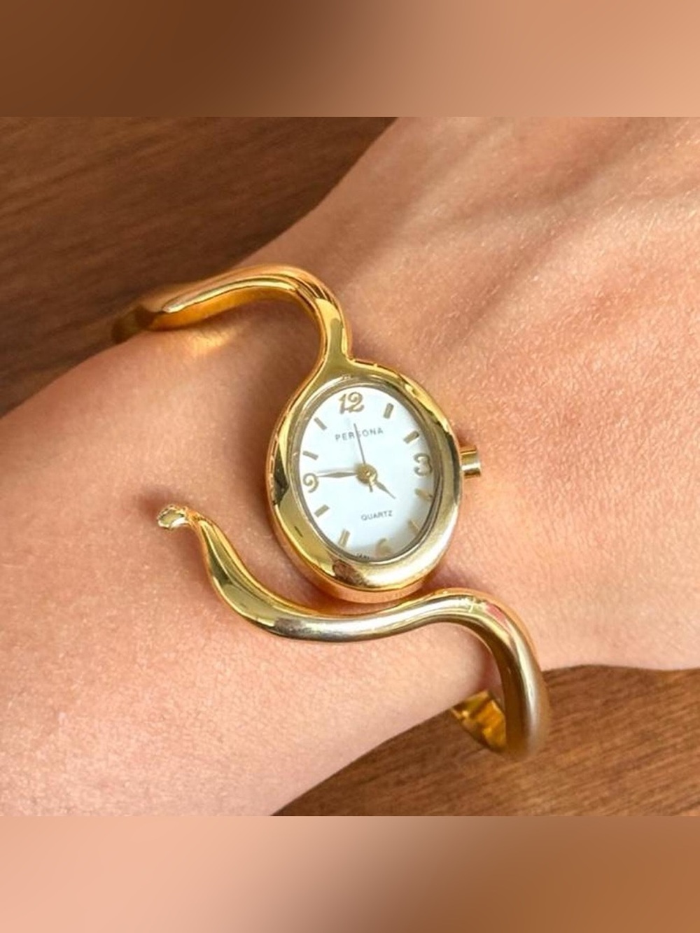 Gold tone Snake Wavy bangle watch with white dial untested